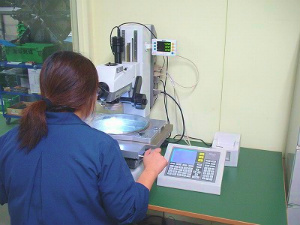 Shipment is checked in Nikon measurement microscope.